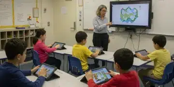 Children learning with technology in a modern classroom setting